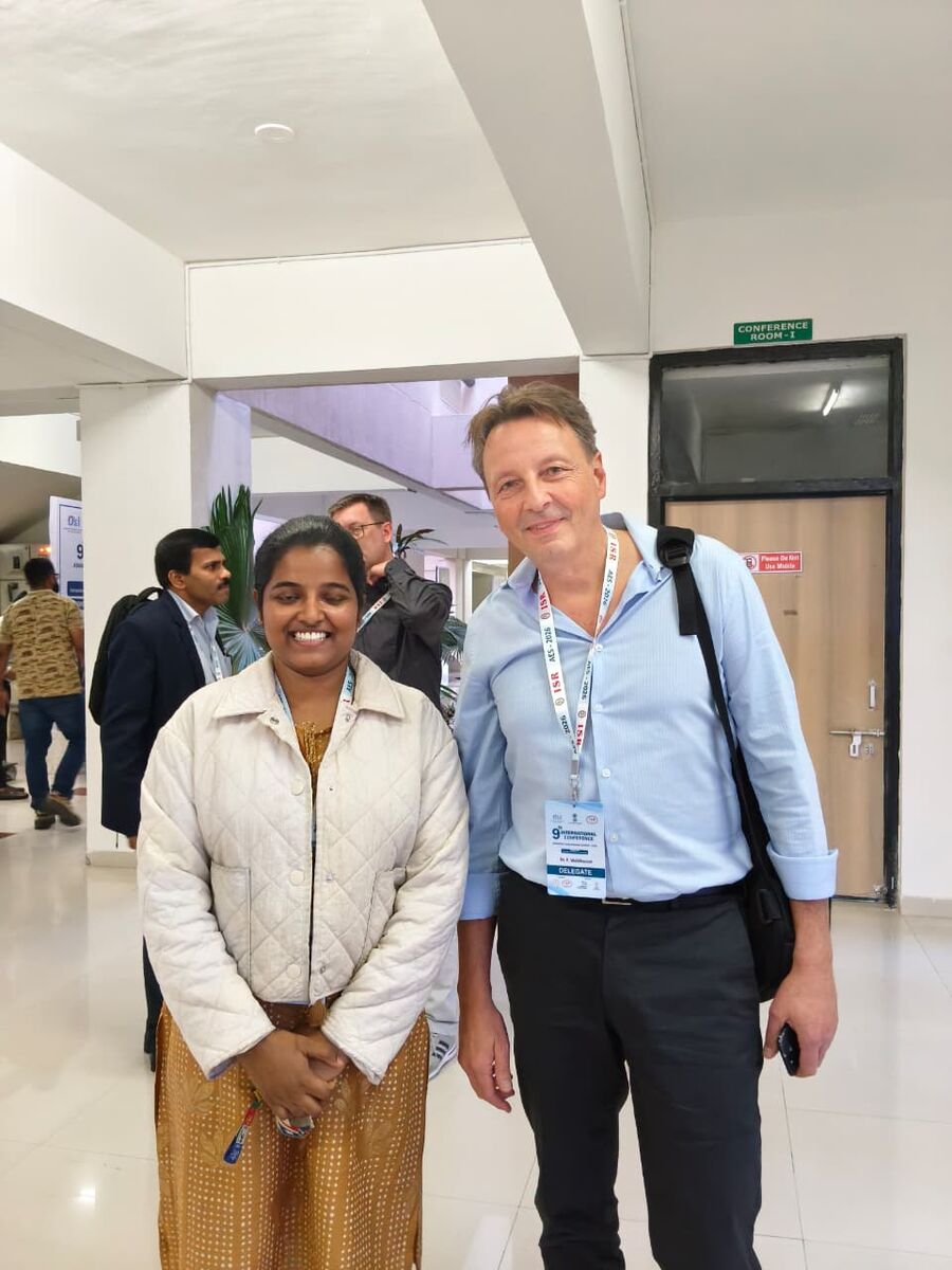 With a collaborator at a conference